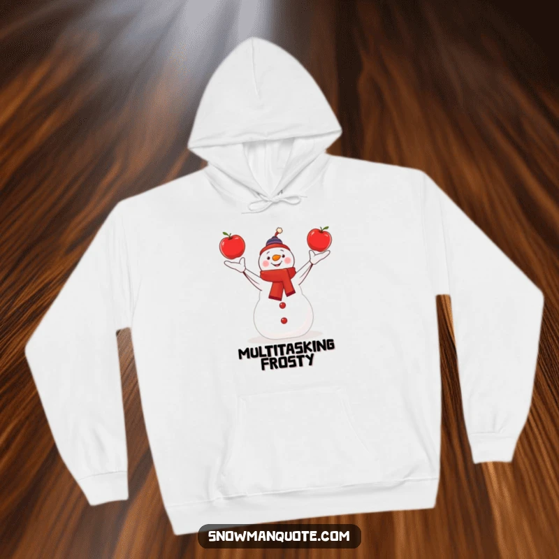 Funny snowman skillfully juggling three bright red apples, featured on a warm and cozy hoodie.