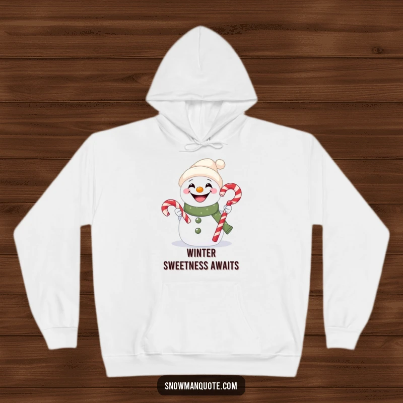 Funny hoodie with a cheerful snowman sporting a big grin and offering a delicious candy cane.