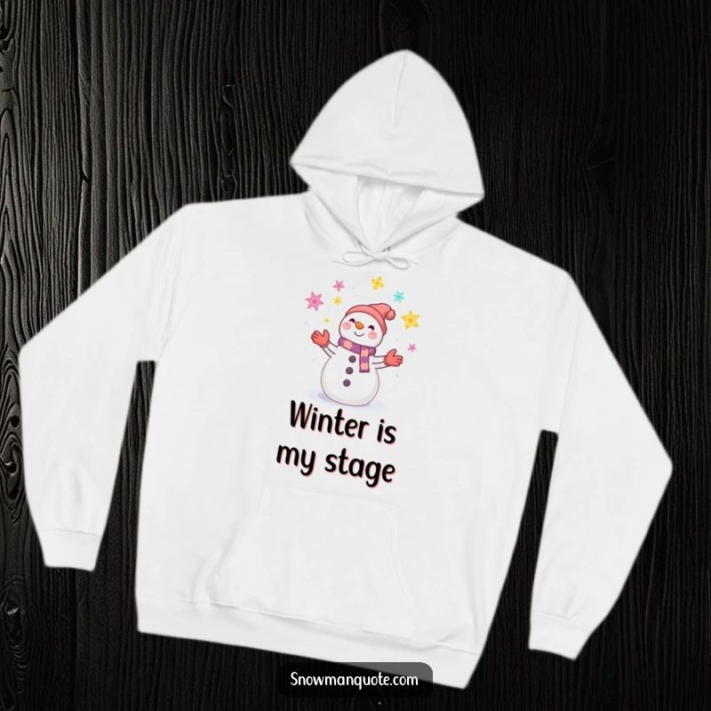 Funny hoodie showcasing a smiling snowman juggling a colorful array of sparkling snowflakes, radiating winter happiness.