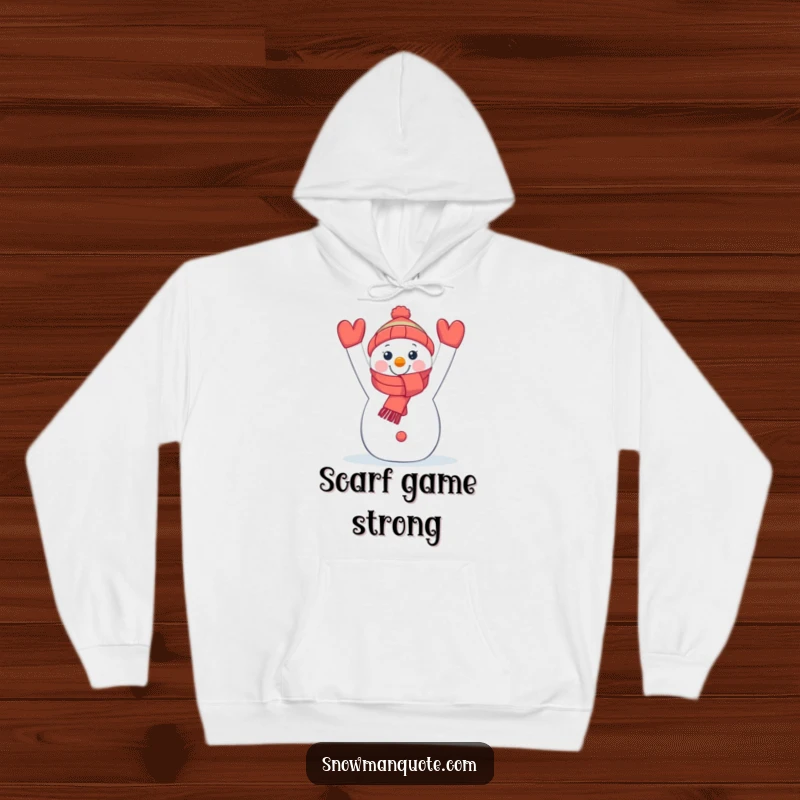 Funny hooded sweatshirt featuring a beaming snowman holding a bright scarf, perfect for staying warm and cheerful.