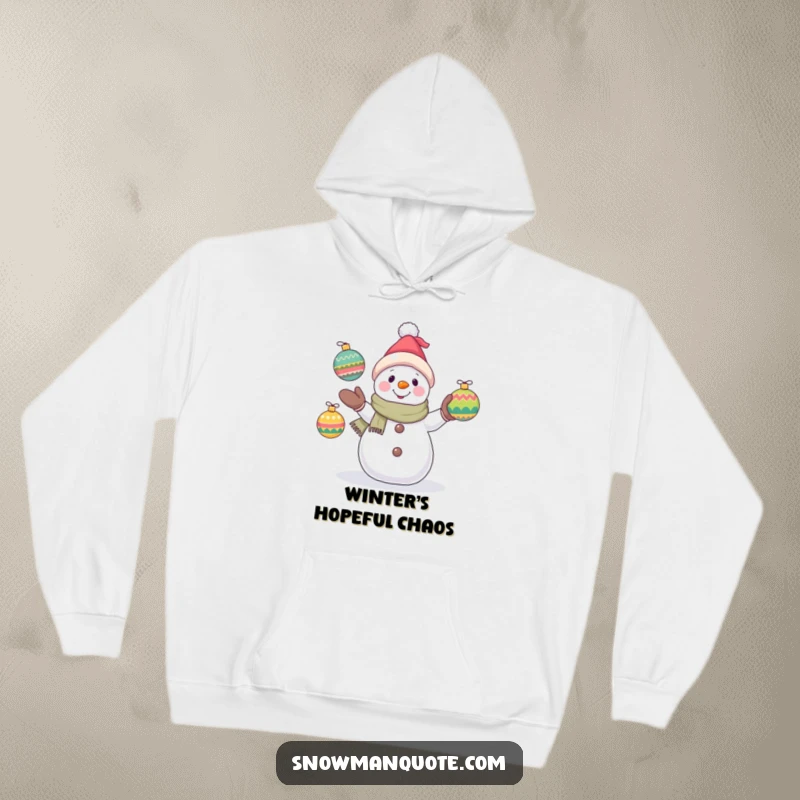 Funny snowman hoodie depicting a hopeful snowman juggling ornaments, offering warmth and a dose of winter's lighthearted fun.