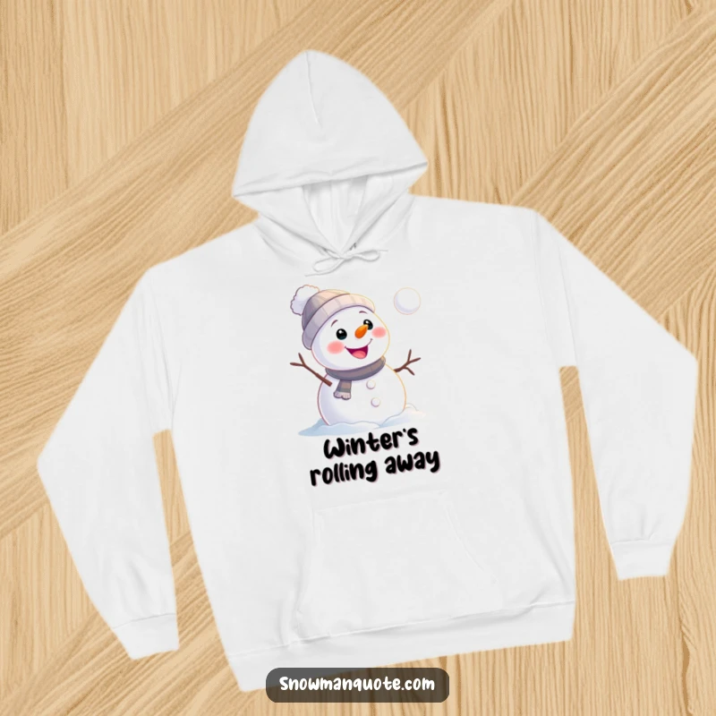 Funny snowman hoodie depicting a cheerful snowman watching a snowball roll away, offering cozy comfort and humorous winter acceptance.