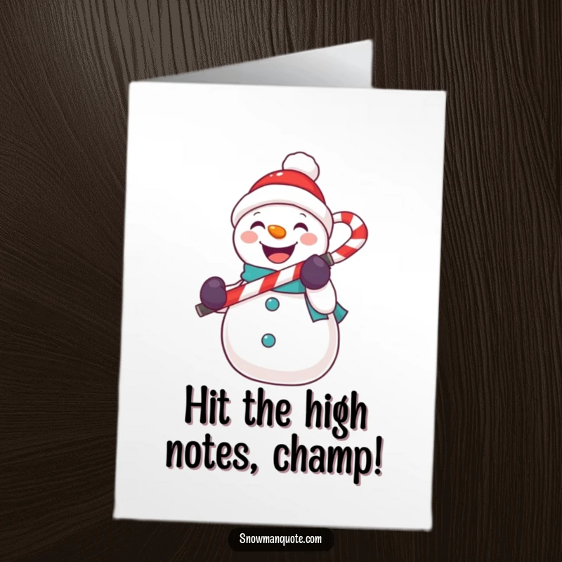 Funny Free Printable Congratulations Card: A snowman holds a candy cane like a microphone, celebrating a big win. Downloadable art.