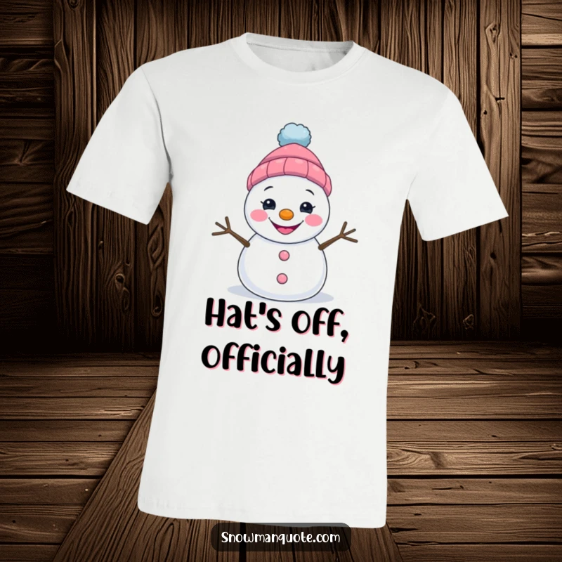 Funny t-shirt depicting a smiling snowman sporting a large grin and a crooked, tilted hat.