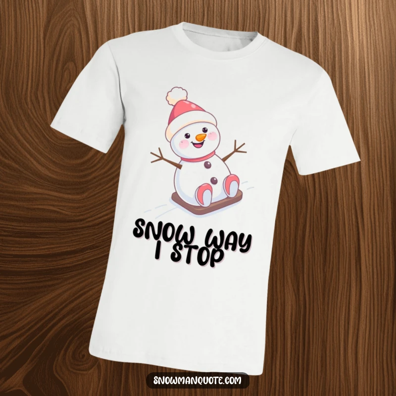 Funny T-Shirt: A happy snowman with a tilted hat gleefully sliding down a snow-covered hill, full of winter energy.