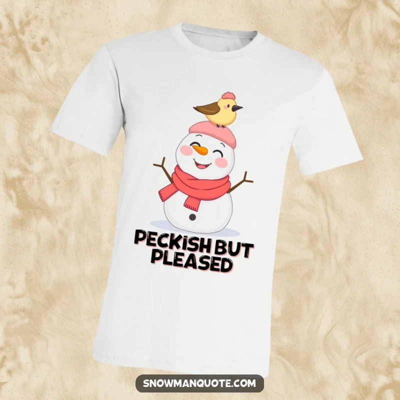 Funny T-Shirt: A smiling snowman looks startled as a bird pecks its hat, capturing a moment of funny winter surprise.