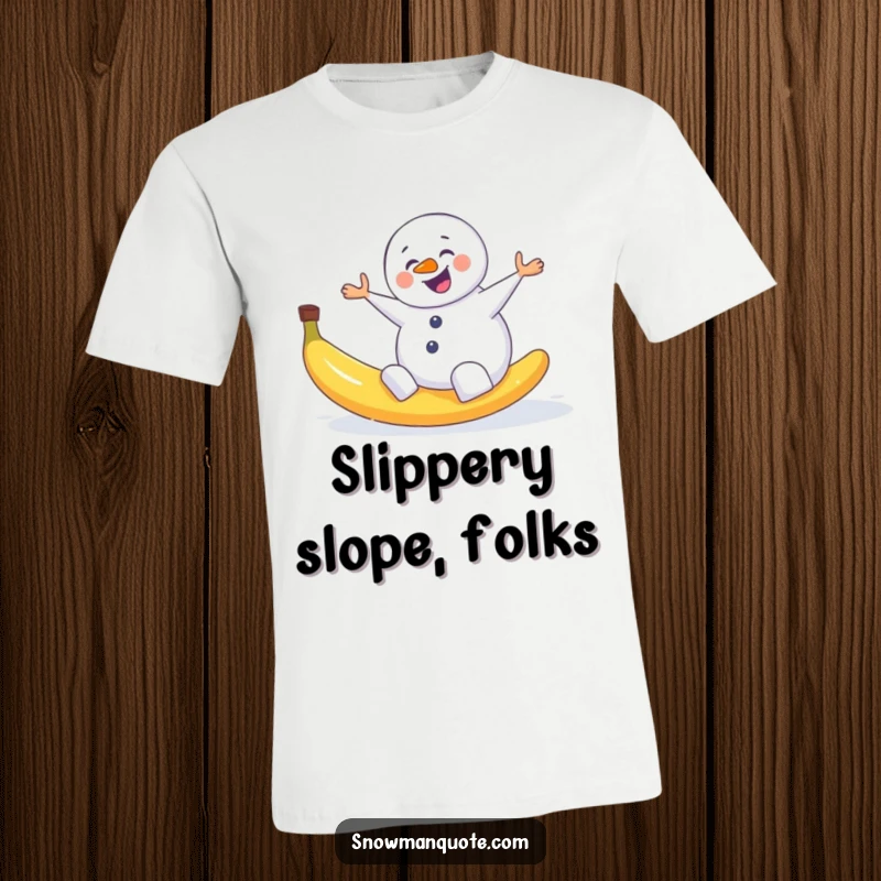 Funny t-shirt illustrating a snowman comically slipping and flailing after hitting a banana peel on a snowy ground.