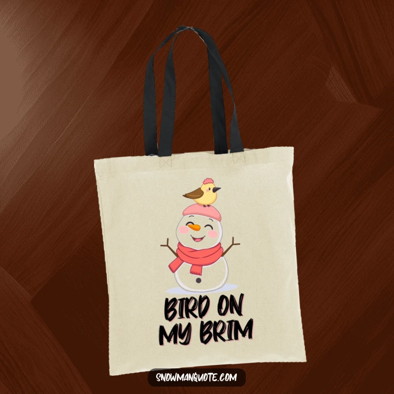 Funny Tote Bag: A smiling snowman looks surprised by a bird pecking its hat, depicting a moment of funny winter interaction.