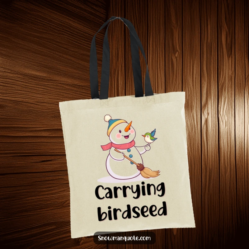 Funny tote bag illustrating a happy snowman delighted by a bird landing on its broom, perfect for everyday use.