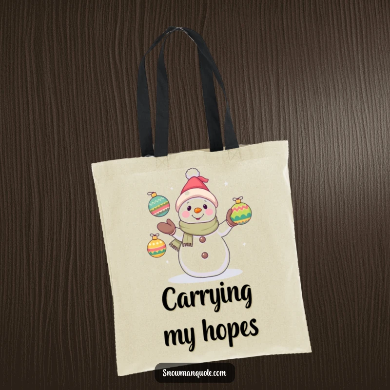 Funny snowman tote bag showing a hopeful snowman juggling ornaments, ideal for carrying holiday treasures and spreading festive vibes.